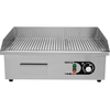 Płyta grillowa o mocy 3,0kW marki YATO YG-04587.
Ryflowana stalowa pływa grillowa o wymiarach 555x350mm i grubości 9mm doskonale przewodzi ciepło. Dzięki temu idealnie nadaje się do smażenia jajek, kiełbasek, bekonu, mięs, opiekania tostów, tortili czy warzyw.
Grzałka o mocy 3,0kW posiada sterowanie za pomocą potencjometru z regulacją temperatury pracy w zakresie 50~300ºC, który umieszczony jest na panelu frontowym. Natomiast z tyłu urządzenia umieszczony jest bryzgoszczelny wyłącznik, który umożliwia wyłączenie grilla, bez konieczności odłączania przewodu zasilającego z sieci. Urządzenie zasilane jest prądem 230V~50Hz. Wbudowany bezpiecznik zapobiega przed przegrzaniem się grilla.
Grill o wymiarach 555x430x230mm waży 18,5kg, klasa ochrony IPX3. Jego obudowa wykonana jest z wysokiej jakości stali nierdzewnej. Dzięki temu grill jest szybki w czyszczeniu i utrzymaniu w czystości. Dodatkowo z przodu płyty grzejnej jest rynienka na tłuszcz i wszelkiego rodzaju odpadki po grillowaniu. Natomiast specjalny otwór spadowy umożliwia zgarnięcie zabrudzeń do dolnej szufladki, którą można łatwo wyciągnąć do mycia.
Dodatkowo boczne oraz tylna ścianka posiadają rant ochronny o wysokości 75mm, który zabezpiecza przygotwywane potrawy przed wypadnięciem oraz chroni przed pryskaniem tłuszczu. Pod spodem urządzenia są cztery nóżki anty-poślizgowe, zapewniające stabilną pozycję na blacie.
 | YG-04587, Elektryczna płyta grillowa ryflowana 55 cm
